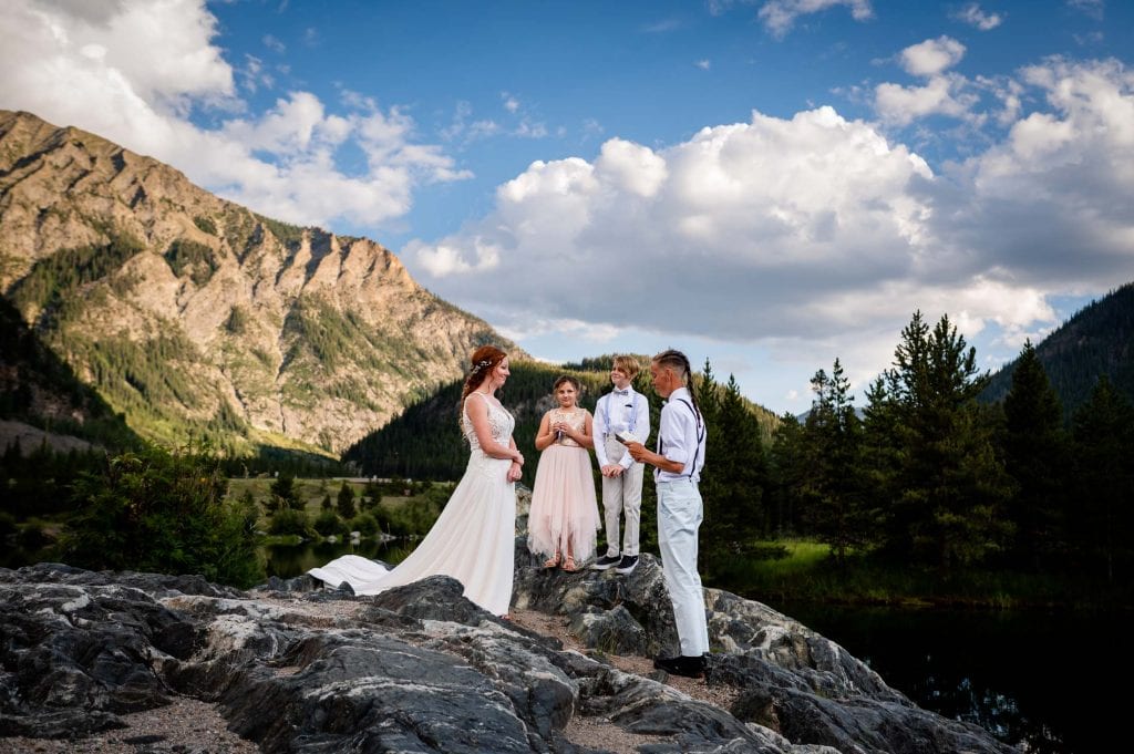 a couple exchanges vows at Officer's Gulch in Colorado