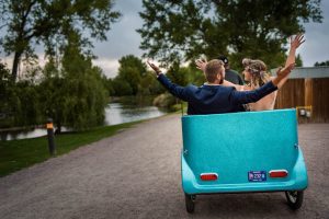 Couple leaving their Colorado elopement ceremony on pedi cab