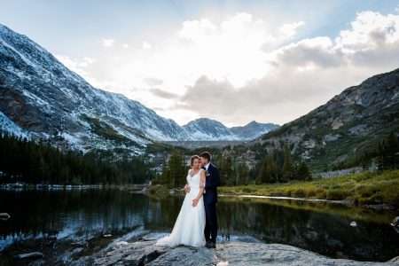 a couple basks in the last light of the day at their Breckenridge Elopement