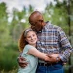 a grampa gives his granddaughter a kiss on the head at their colorado family photography experience