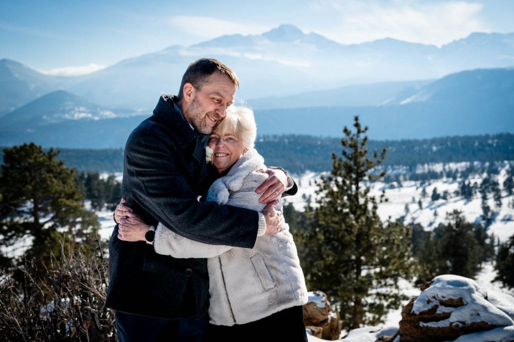 a mother and son hug and celebrate his wedding ceremony at 3M curve in Rocky Mountain National Park.