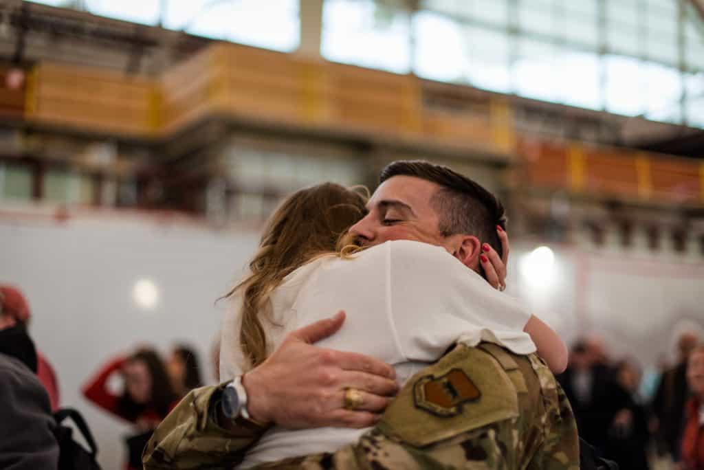 a soldier returns from deployment at denver international airport