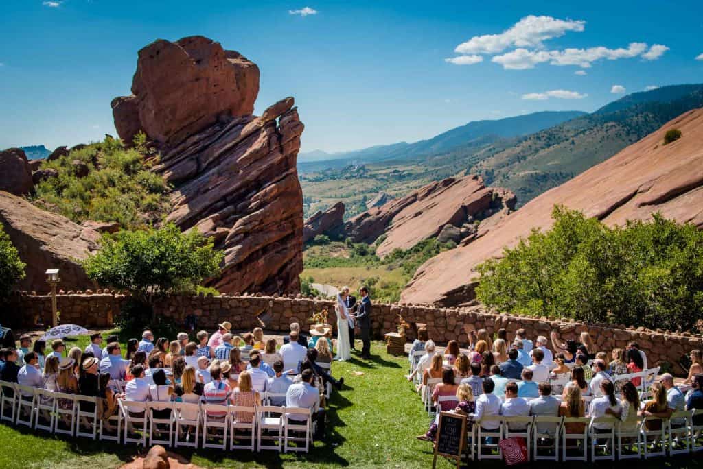 a wedding ceremony at the Trading Post Backyard at Red Rocks Amphitheater in right at Colorado's Rocky Mountains foothills
