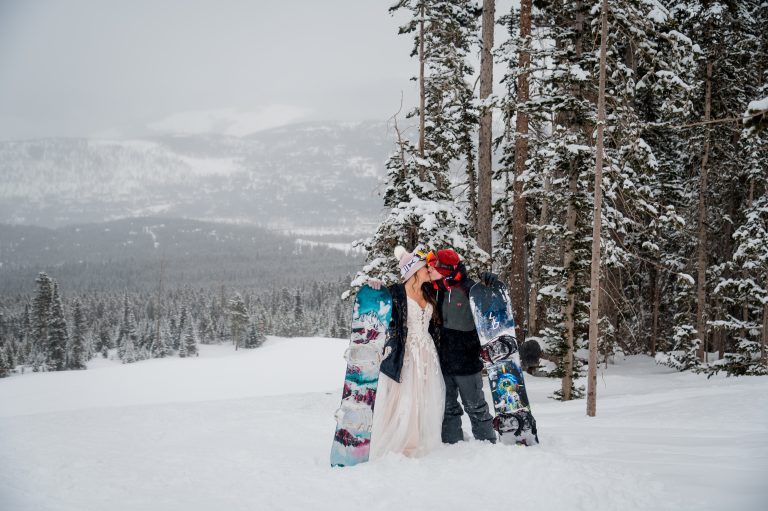A couple snowboards for their elopement in Colorado