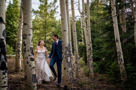 a couple laughs in an aspen forest together at their adventure elopement in Colorado