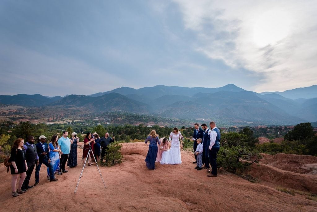 a family prepares for an elopement ceremony at Garden of the Gods