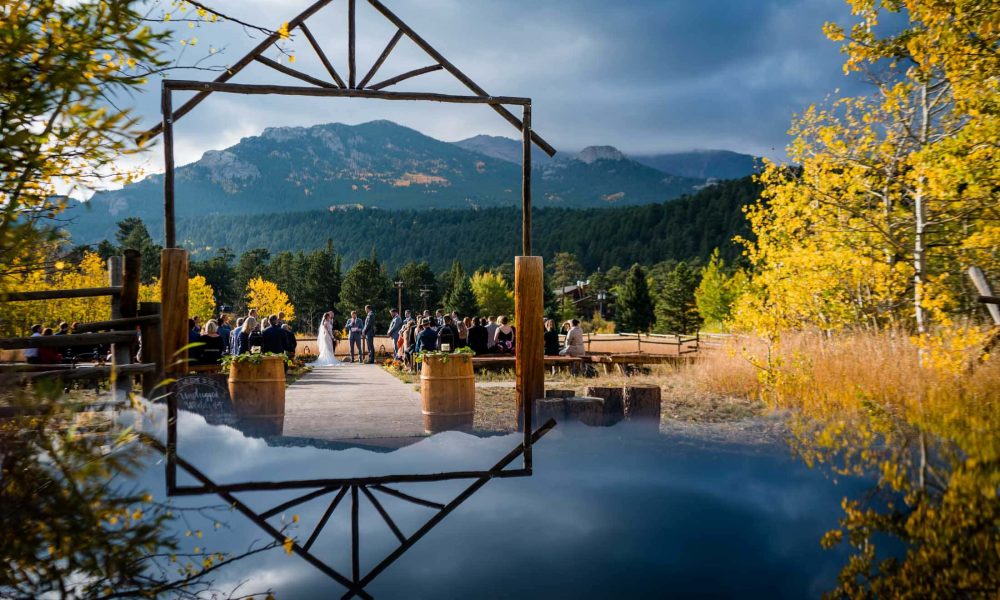 ceremony photo with reflection at Wild Basin Lodge near Estes Park with views of Mt Meeker in the background