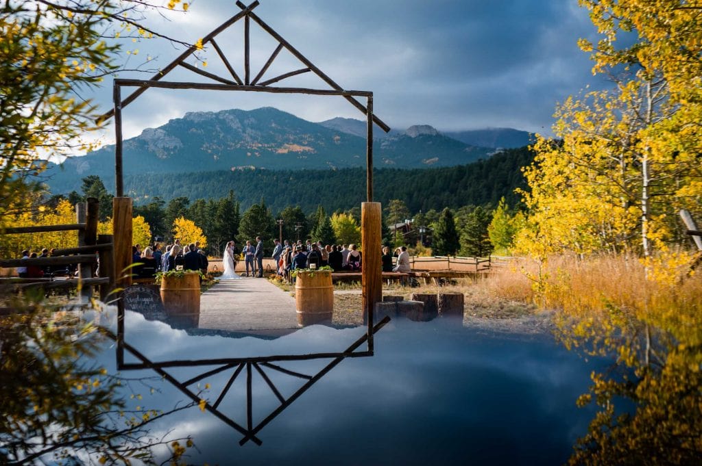 ceremony photo with reflection at Wild Basin Lodge near Estes Park with views of Mt Meeker in the background