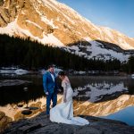 couple elopes on the shore of blue lakes in Breckenridge at sunrise