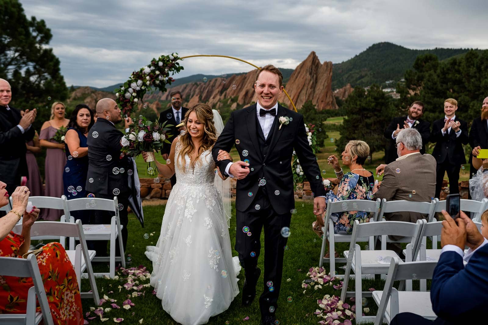 a couple has their bubble exit from their wedding at Arrowhead Golf Club in Colorado