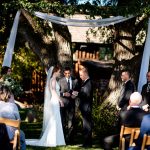 a couple shares their vows at Spruce Mountain Ranch in Colorado