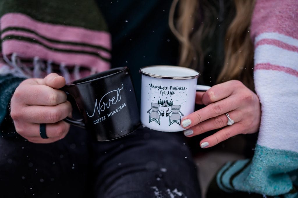 a couple shares coffee as an activity on their elopement day 