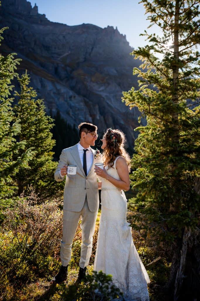 a couple shares a toast at their elopement in Ouray near Yankee Boy Basin