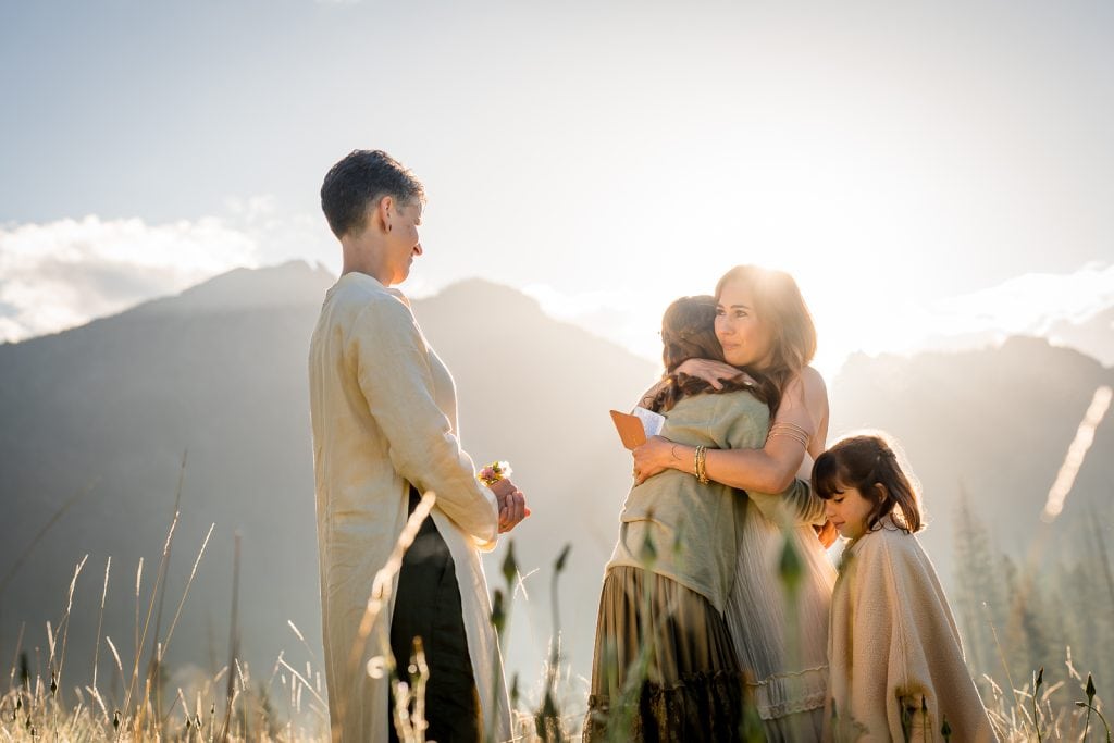 a couple shares vows with their daughters at their elopement just outside of Pagosa Springs